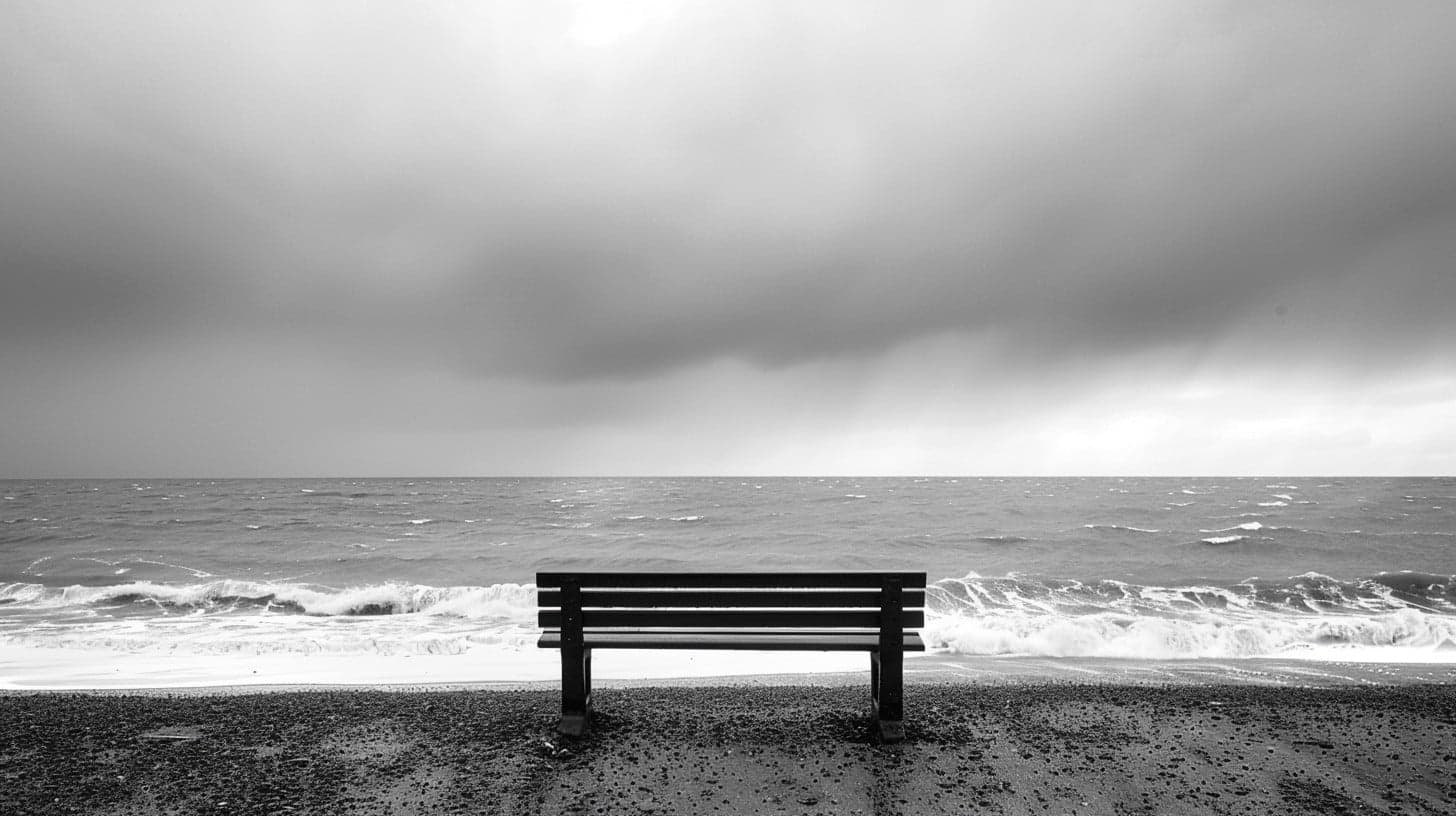 A lone bench facing the sea
